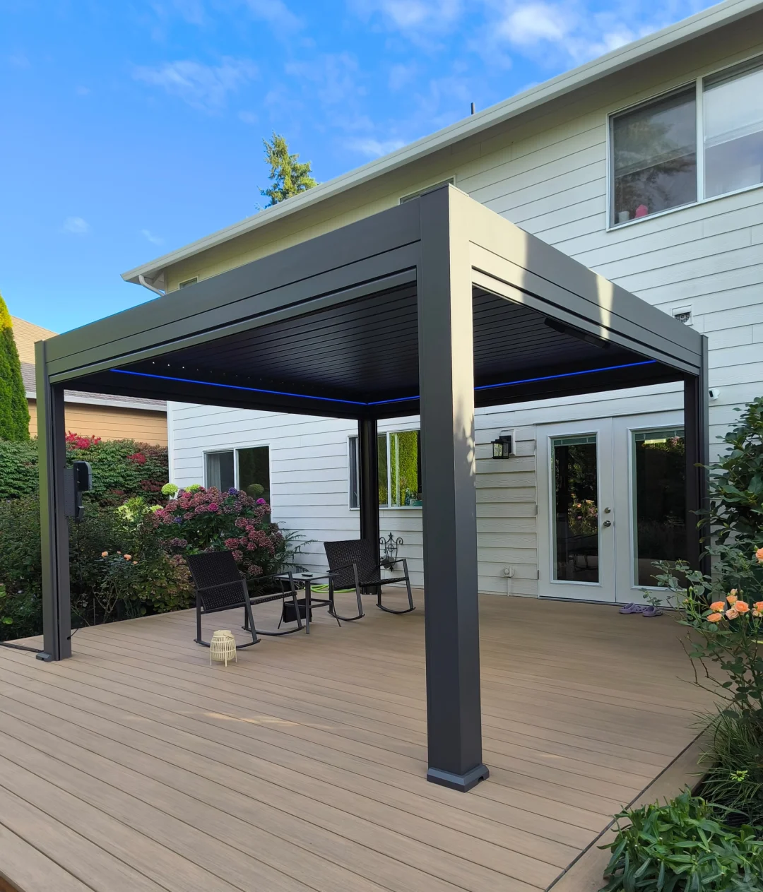 Main Bioclimatic Pergola Structure View with motorized adjustable louvers in white villa patio